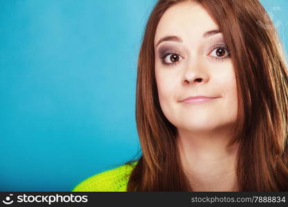 Young people teenage concept - woman teenager girl wide eyed portrait on blue