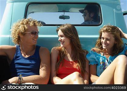 Young people traveling in pickup truck