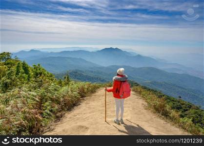 Young people walking on a hilltop in Doi Inthanon, Chiang Mai, Thailand