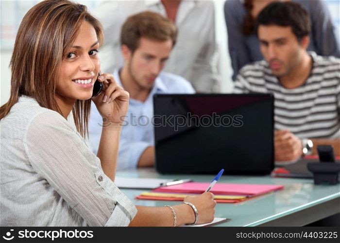 Young people with a laptop and cellphone
