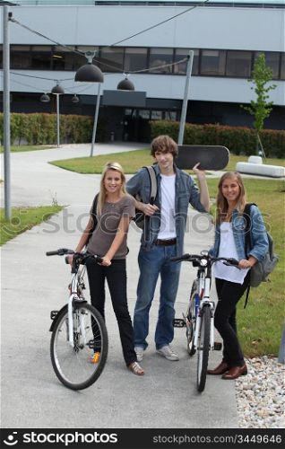 Young people with bicycles and skateboard