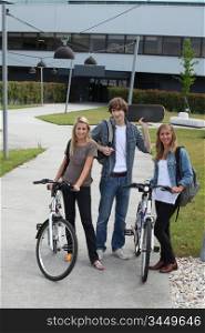 Young people with bicycles and skateboard