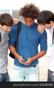 young people with mobile phone at college campus
