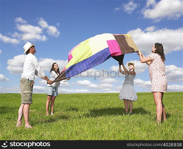 young people with picnic blanket