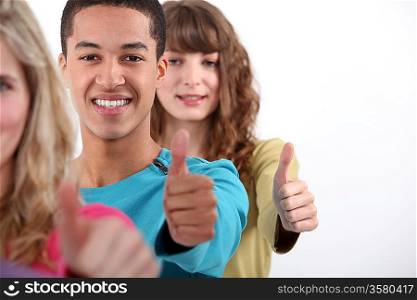 Young people with thumbs up