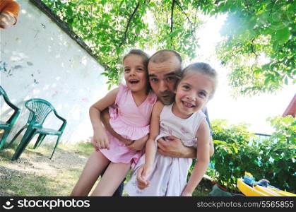 young peple group with young little twins girls outdoor