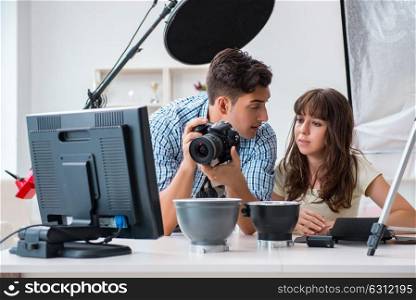Young photographer working in photo studio. The young photographer working in photo studio