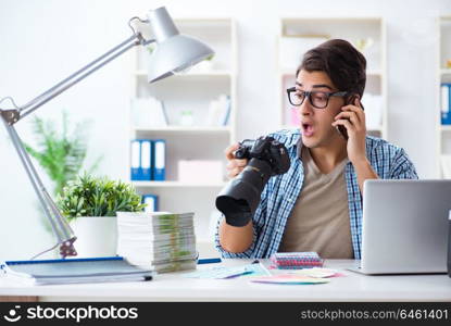 Young photographer working with his camera