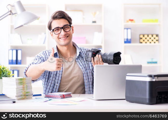 Young photographer working with his camera