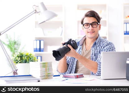 Young photographer working with his camera