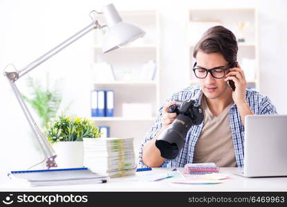 Young photographer working with his camera