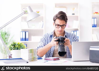 Young photographer working with his camera