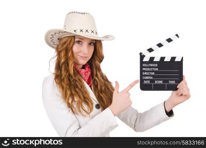 Young pointing cowgirl with movie board isolated on white
