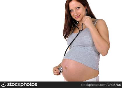 young pregnant woman listening stethoscope of his future child