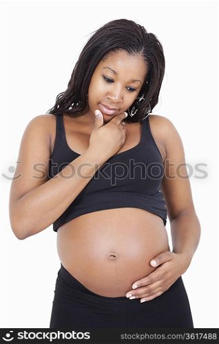 Young pregnant woman think with hand on chin over white background