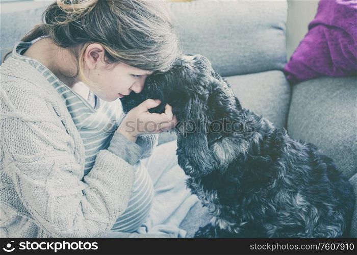 Young pregnant woman with her dog