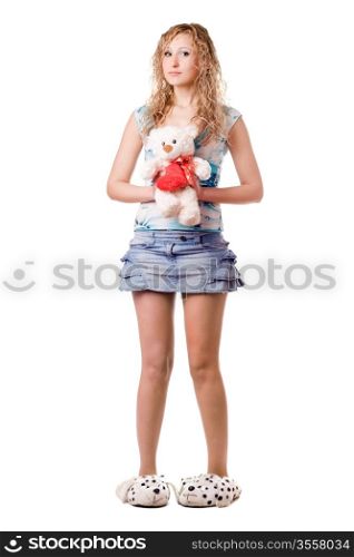 Young pretty blonde holding teddy bear. Isolated on white