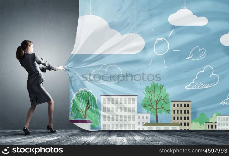 Young pretty businesswoman pulling clothing banner with illustration. Place for your advertisment