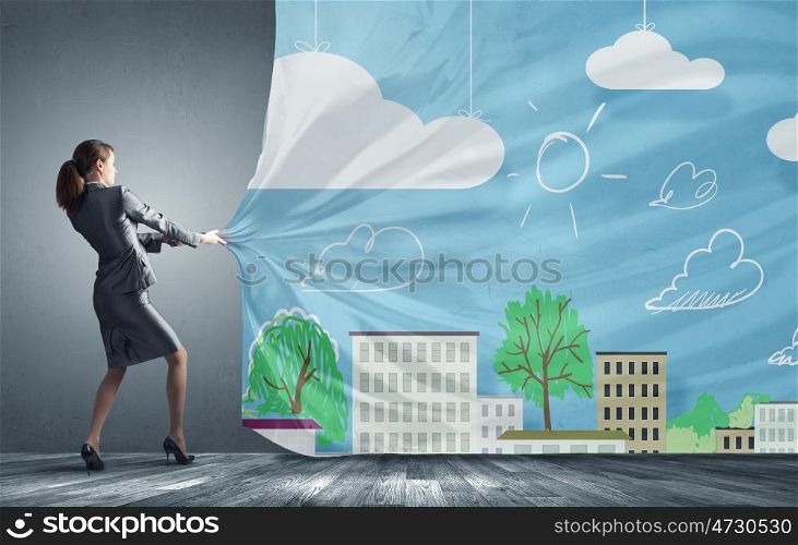 Young pretty businesswoman pulling clothing banner with illustration. Place for your advertisment