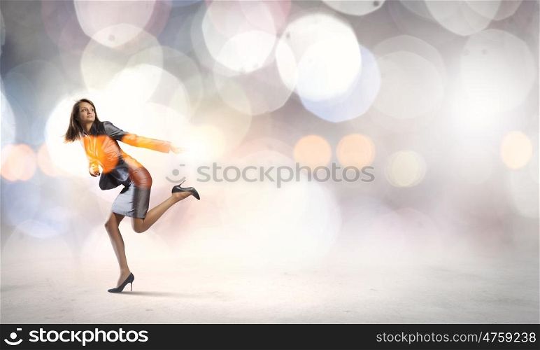 Young pretty businesswoman running in a hurry