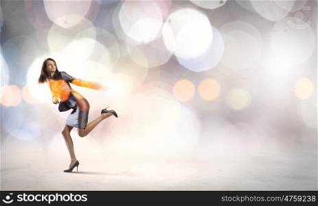 Young pretty businesswoman running in a hurry