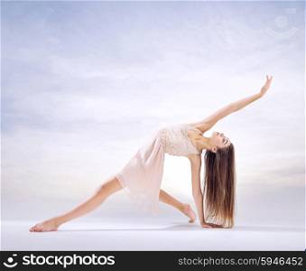 Young, pretty dancer in art ballet figure