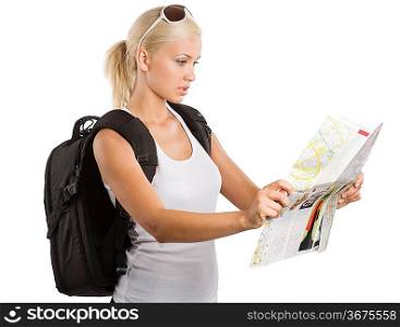 young pretty student girl in vacation looking for place on a map with rucksack