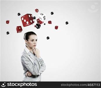 Young pretty thoughtful woman trying to make decision. Risky businesswoman