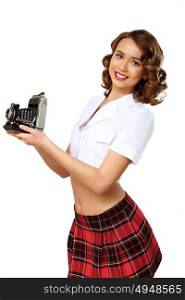Young pretty woman dressed in retro style with camera