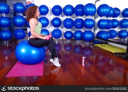 young pretty woman exercising in a fitness center