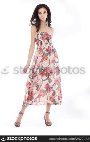 Young pretty woman in elegant light fashion dress, studio shot, series of photos