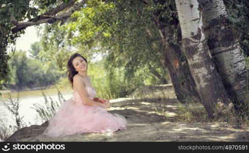 young pretty woman in forest in spring time