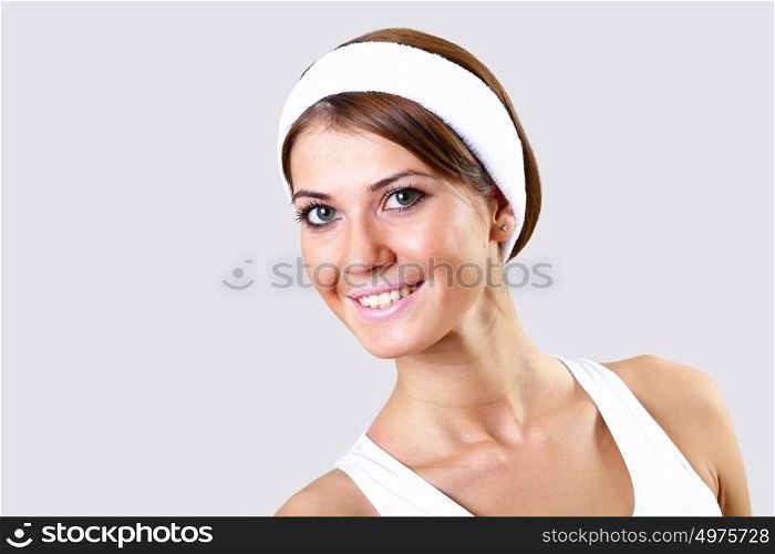 Young pretty woman in sport wear doing sport