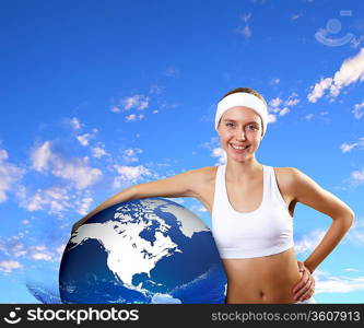 Young pretty woman in sport wear standing