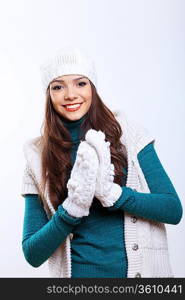 Young pretty woman in warm winter hat and scarf