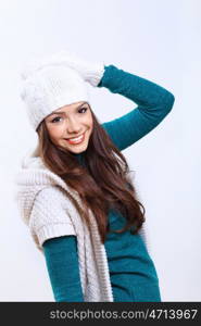 Young pretty woman in warm winter hat and scarf