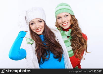 Young pretty woman in warm winter hat and scarf