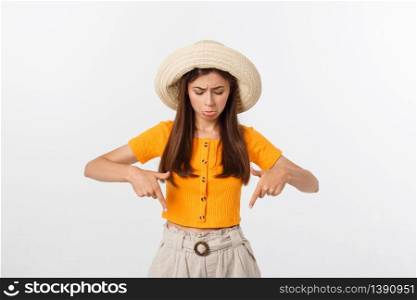 young pretty woman looking unhappy and stressed, suicide gesture making gun sign with hand, pointing to copy space. young pretty woman looking unhappy and stressed, suicide gesture making gun sign with hand, pointing to copy space.