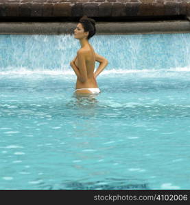 Young pretty woman relaxing in a swimming pool