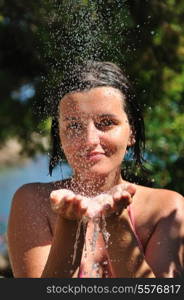 young pretty woman relaxing under shower