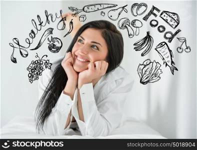Young pretty woman thinking of healthy food closeup face portrait and sketches overhead