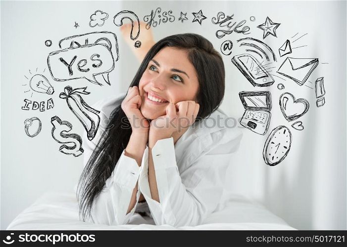 Young pretty woman thinking of her plans closeup face portrait and sketches overhead