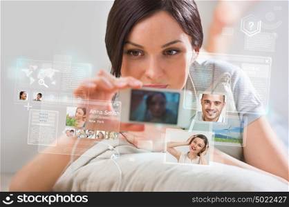 Young pretty woman using social media on her smartphone