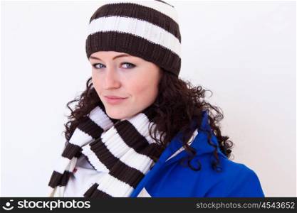 young pretty woman wearing winter hat and scarf