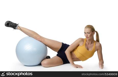 young pretty woman with gym body , doing fitness exercise with ball isolated on white