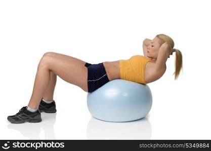 young pretty woman with gym body , on big ball doing fitness exercise . Natural skin