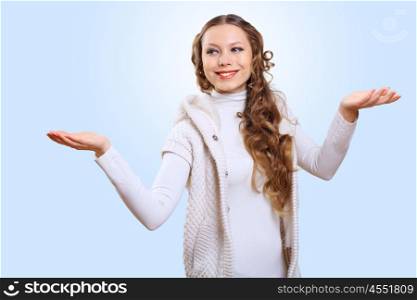Young pretty woman with lomng hair wearing warm pullover