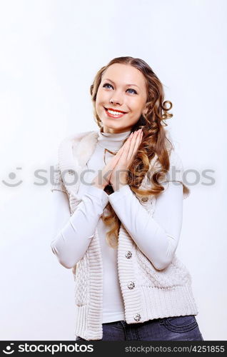 Young pretty woman with long hair wearing warm pullover