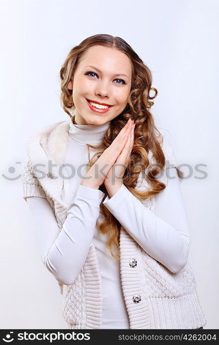 Young pretty woman with long hair wearing warm pullover