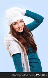 Young pretty woman with long hair wearing warm pullover